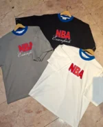 خرید تیشرت NBA مردانه در سه رنگ سفید مشکی و طوسی چیده شده کنار هم در مزون رم تهران